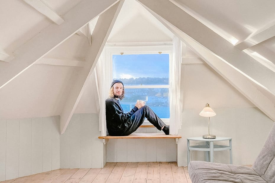 Relaxed on his bed, a man considers the impact of tax on holiday lettings.